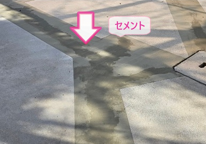 車庫コンクリート床の補修工事でラインを出してセメントを塗っている様子